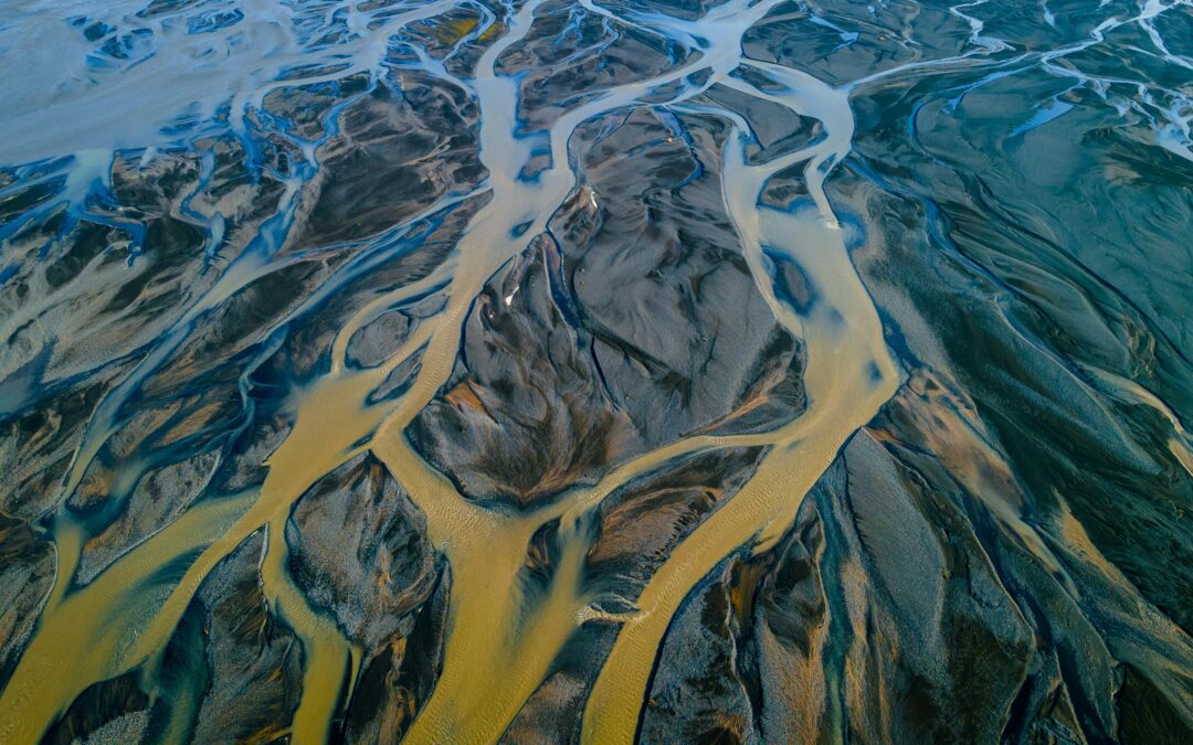 An aerial image of a floodplain with muddy waters.