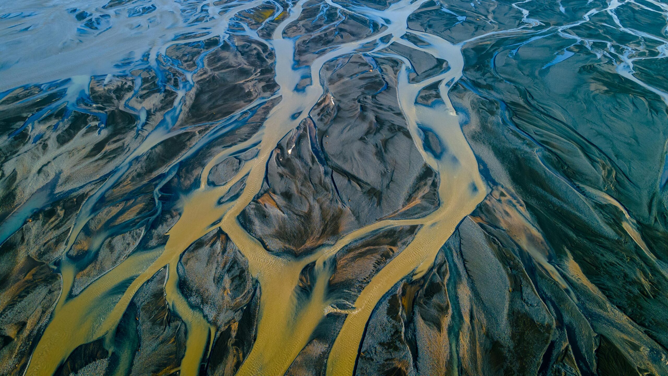 An aerial image of a floodplain with muddy waters.