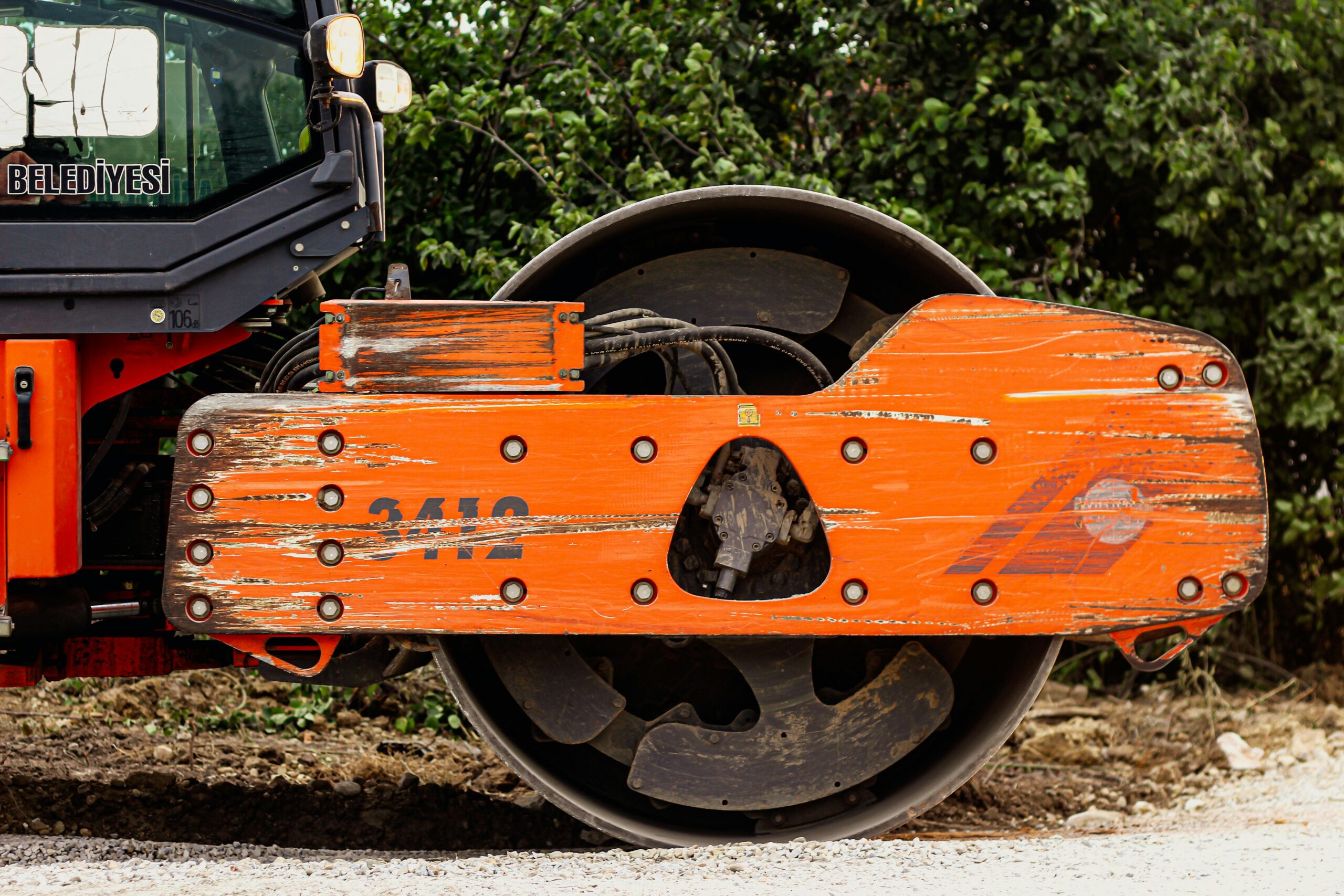 A construction roller prepares for repaving.