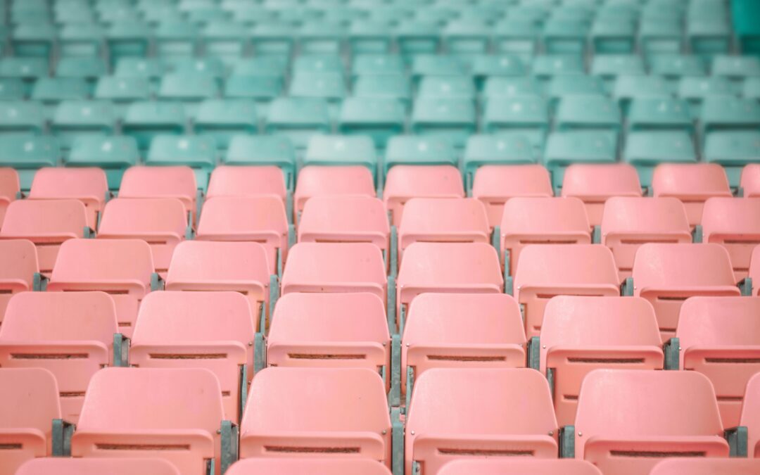 Red and green stadium seats in rows.