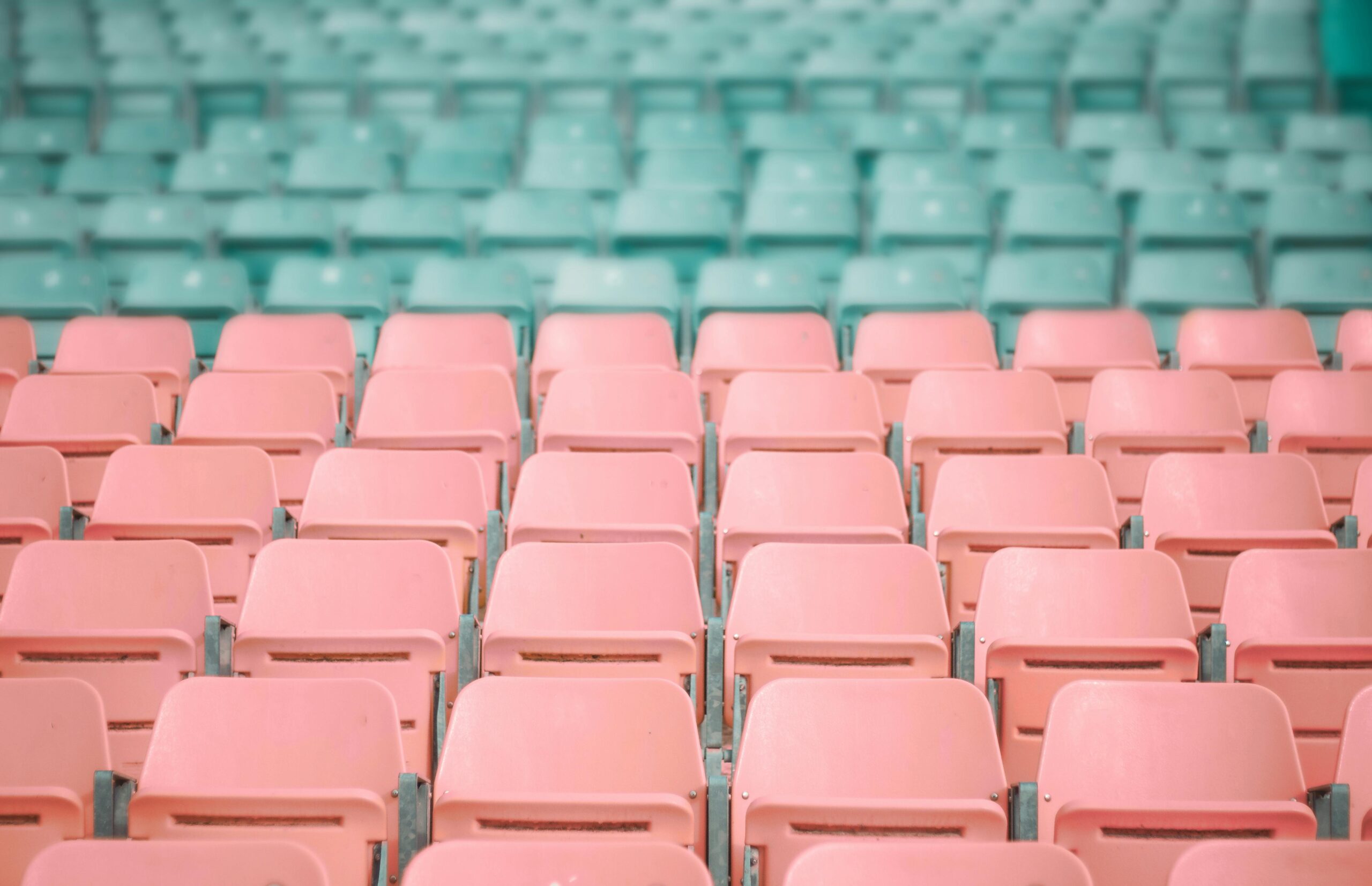 Red and green stadium seats in rows.