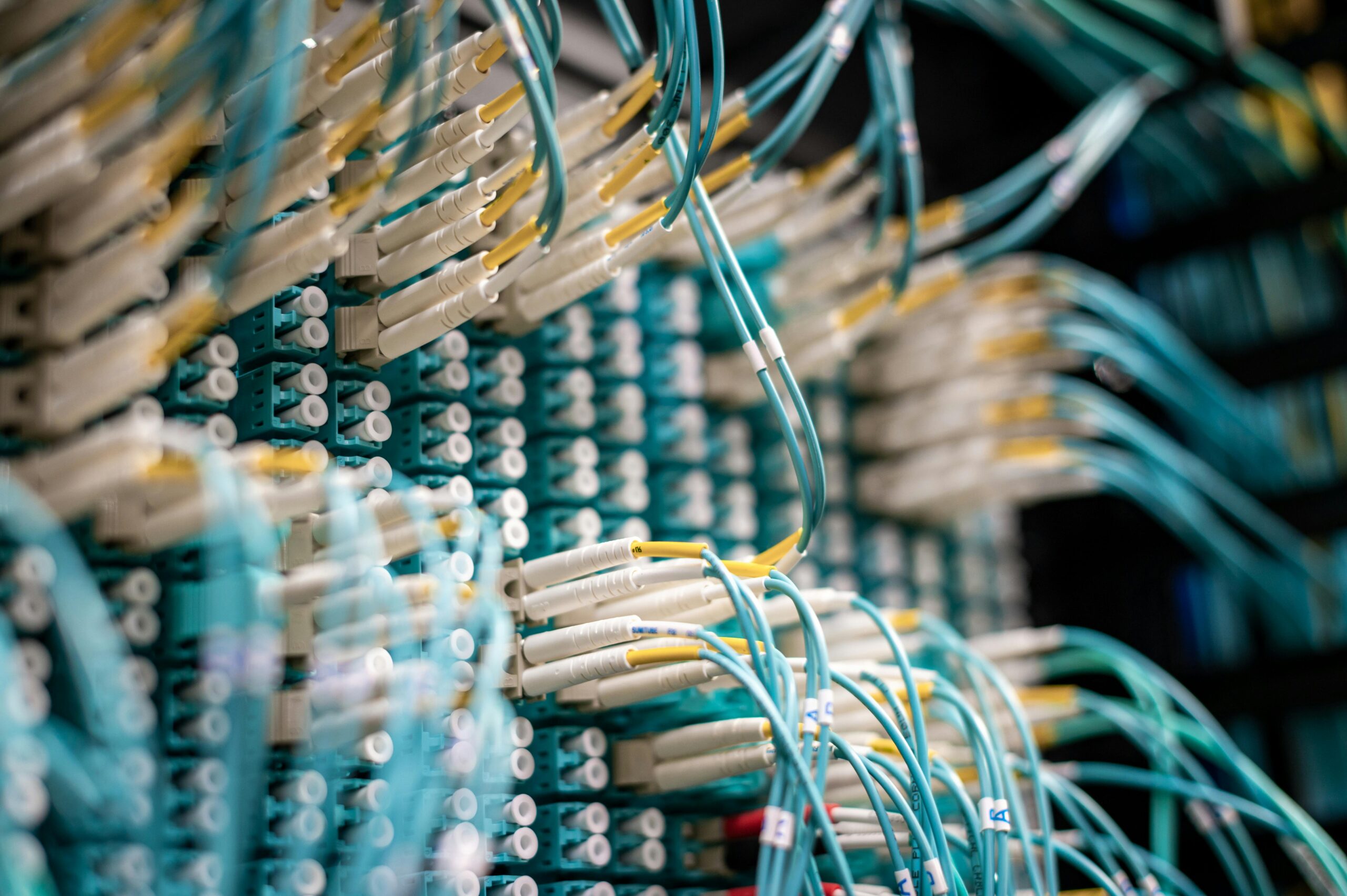 A series of blue internet and broadband cables connecting to a large device.