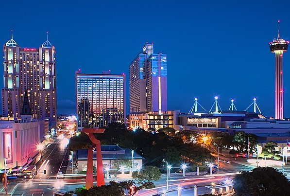 San Antonio's skyline from a distance at night.