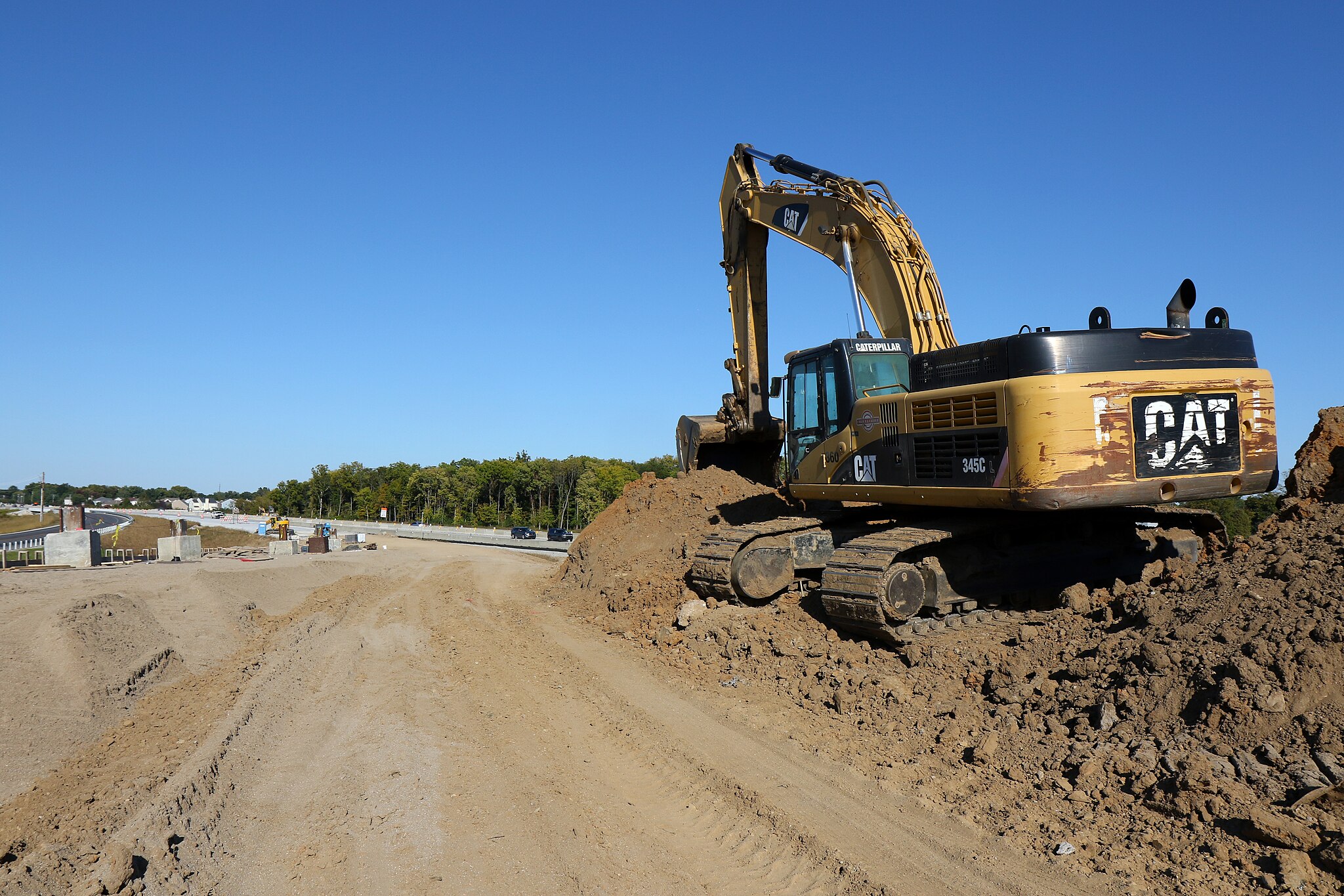 A construction vehicle on a dirt mound in Indiana.