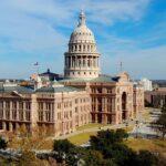 A distant view of the Texas State Capitol building in Austin.