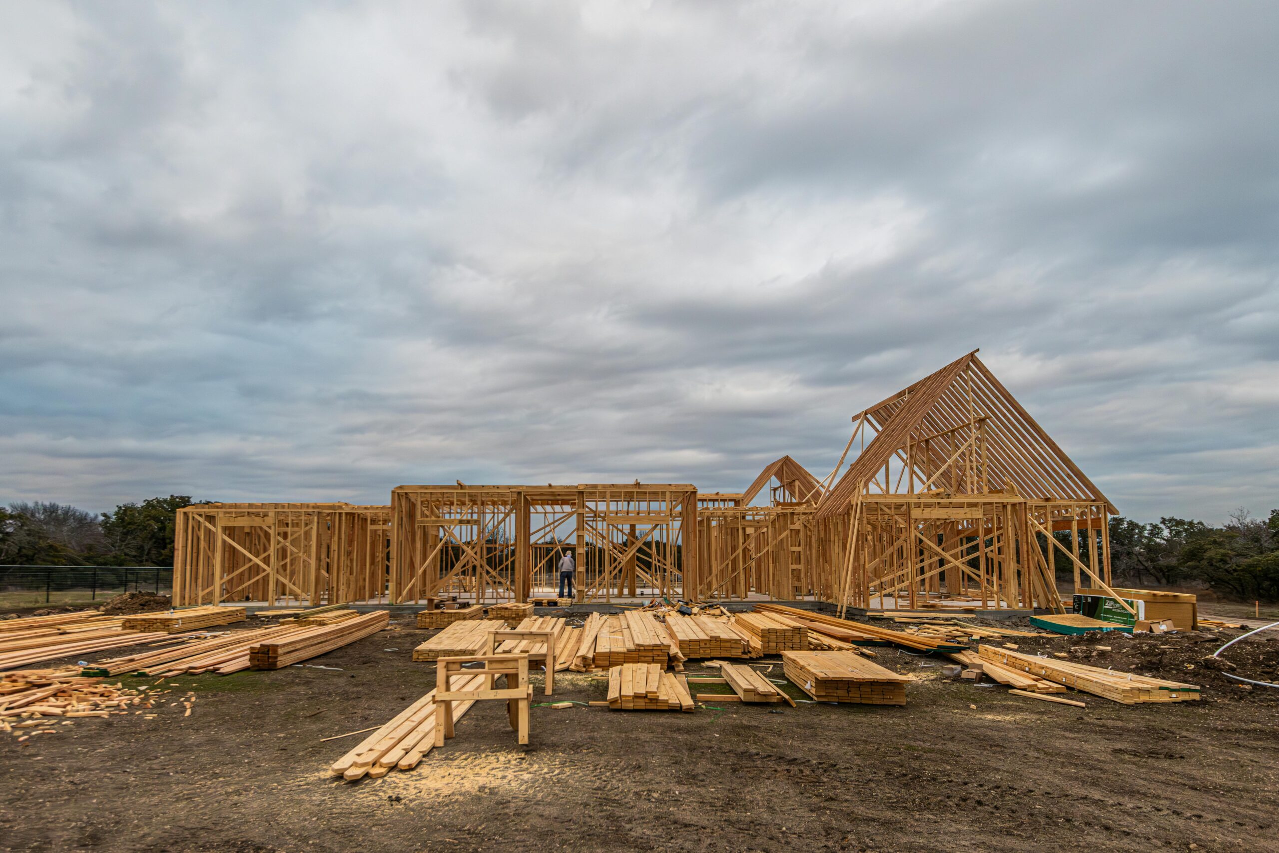 A housing development before cloudy skies and distant trees in Fort Worth.