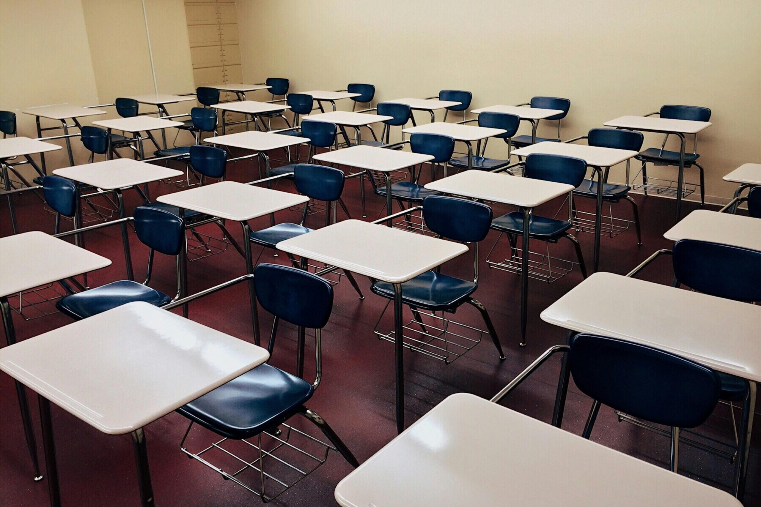 A classroom full of empty desks for students.
