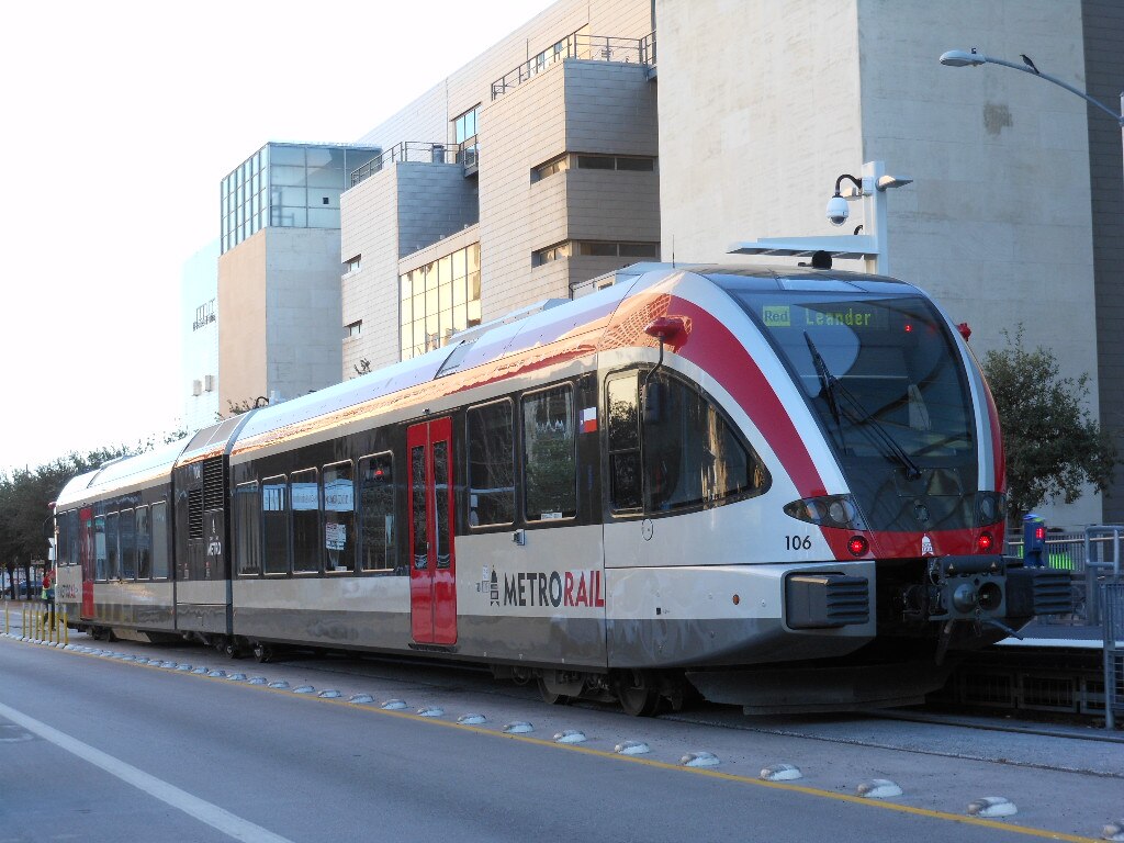 A CapMetro train along track travelling to Leander from Austin.