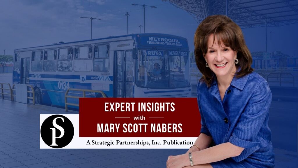 Mary Scott Nabers before a bus at a bus station for her weekly column.