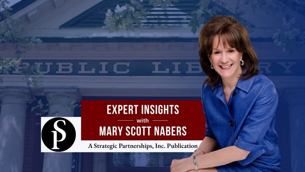 Mary Scott Nabers before a public library sign for her weekly column.