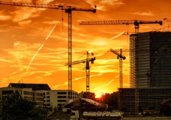 construction site cranes 340x240 Architect association forecasts 5.4% increase in 2022 construction spending